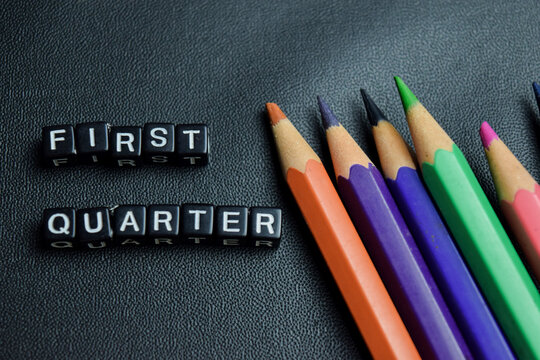 First quarter text stacked wooden cubes on the table
