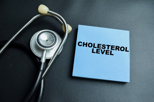 Concept of cholesterol level write on sticky notes isolated on table.
