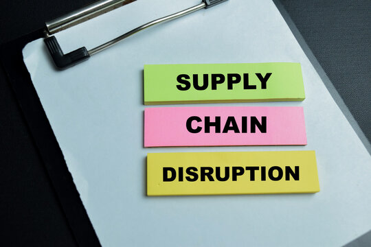 Concept of supply chain distribution write on sticky notes isolated on table.