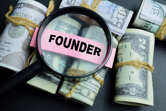 Concept of founder write on sticky notes isolated on table.
