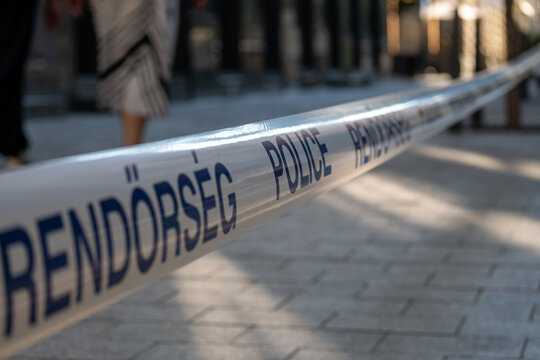 Police Crime Scene Tape Restricting Access to Public Area