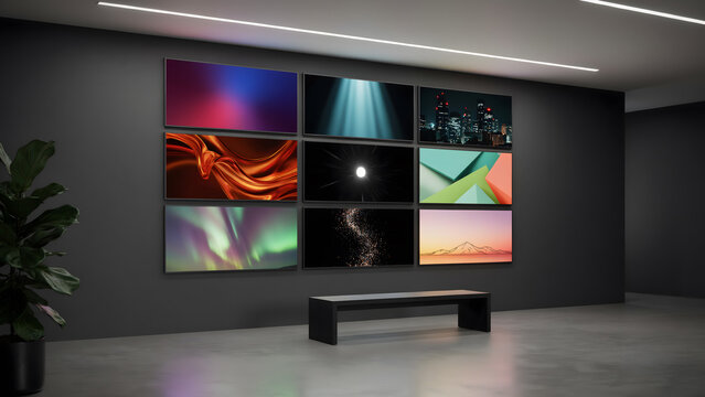 Modern gallery wall features nine digital display screens mounted in dark minimalist room.