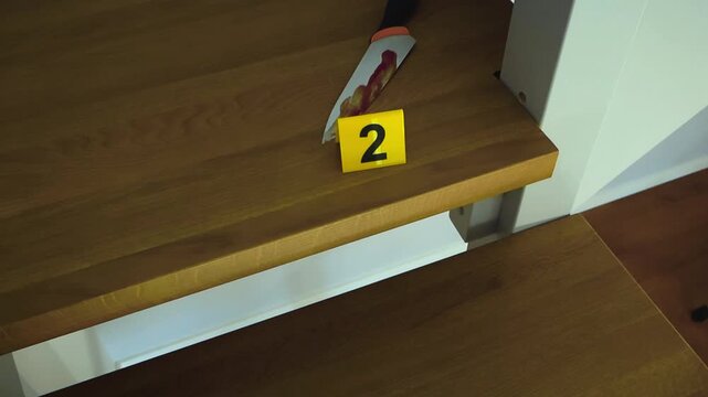 Chilling crime scene with a bloody knife lying on a wooden staircase next to a yellow evidence marker, suggesting a violent murder or homicide investigation in progress at a residential home