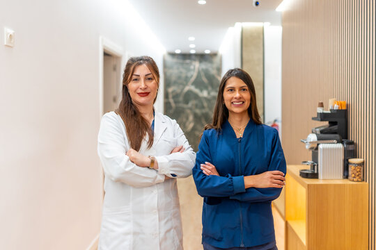 Female practitioners presenting aesthetic clinic for laser grooming services