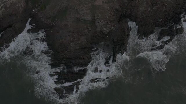 Aerial drone view of Mui Ne fishing village and Ganh Da Mui Ne coastline in Lam Dong, Vietnam, with fishing boats at sea, sandy beaches and a scenic coastal landscape.
