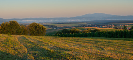 Fototapeta premium A mountain meadow after haymaking