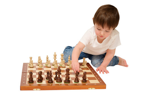 Little boy playing chess on isolated transparent background. Child learning board game strategy. Intellectual development and concentration. Smart preschool activity, hobby and logic challenge.