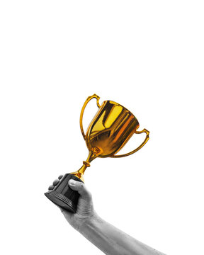 A contemporary artistic collage featuring a hand holding a trophy isolated on free background.
