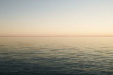 Fototapeta premium Minimalist Sunset Horizon Over Calm Sea Water with Soft Pastel Colors