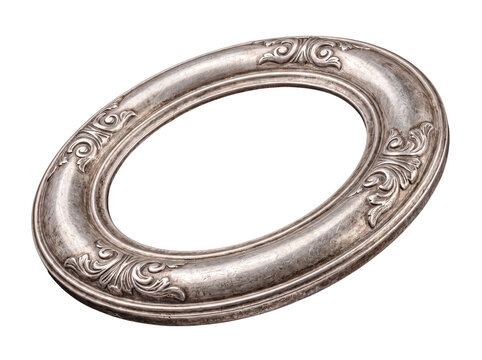Antique silver oval picture frame with baroque carving and distressed texture, angled, transparent background.