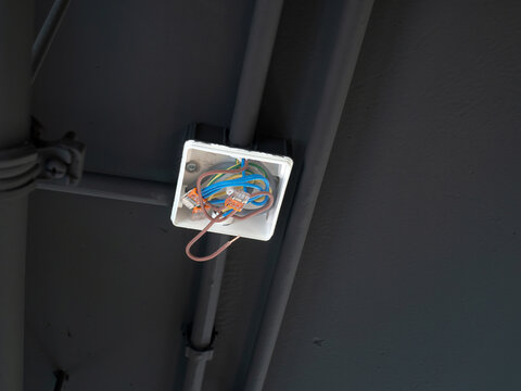 Electrical Junction Box with Wires on Industrial Ceiling