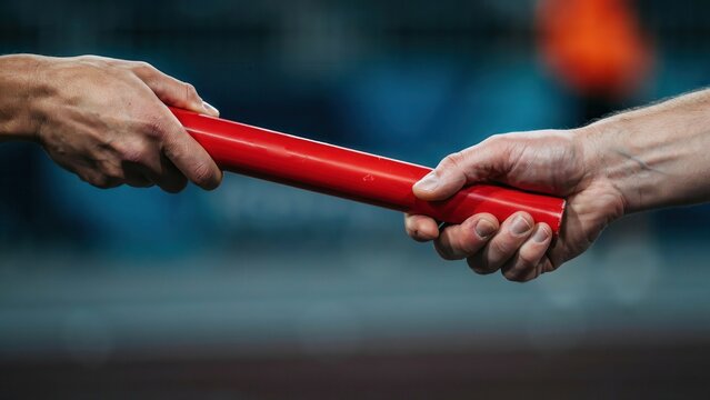 Athletes passing a red relay baton during a track race. This imagery represents teamwork, professional success, and seamless business transition concepts.