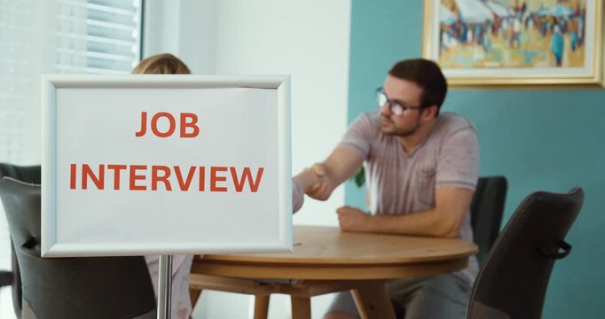 Recruiter talking with a candidate during a job interview, representing hiring, recruitment, employment, career opportunities, and professional communication.