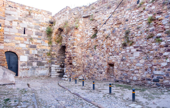 Weathered medieval fortress walls and arched passage in Chios Town on Chios Island, Greece