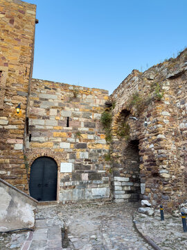 Weathered stone passage and arched door at medieval Chios Castle on Chios Island, Greece