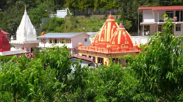 Kainchi Dham Temple Shikhara Framed by Green Hillside Foliage Near Bhowali, Uttarakhand