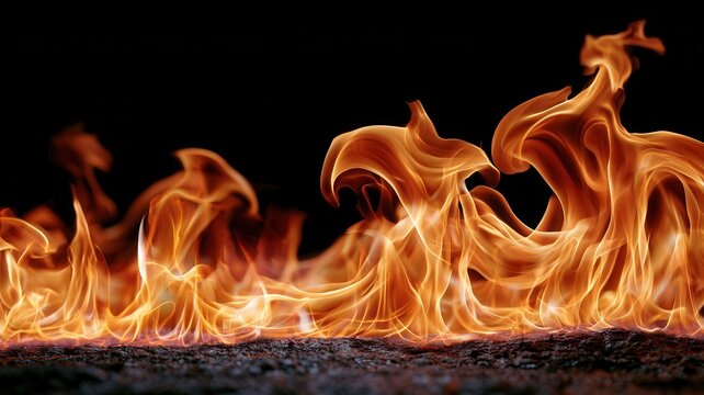 Fiery orange flames and red embers creating a captivating display of warmth and energy dark background against