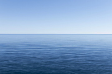 Fototapeta premium Wide Ocean Horizon Under Clear Blue Sky