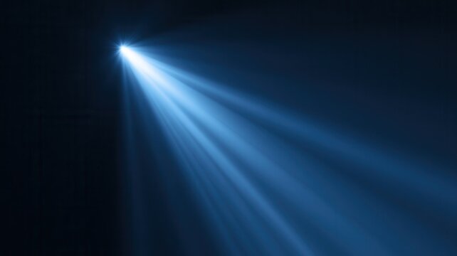 Solitary blue beam pierces a veil of smoke casting focused energy onto a dark stage or abstract background