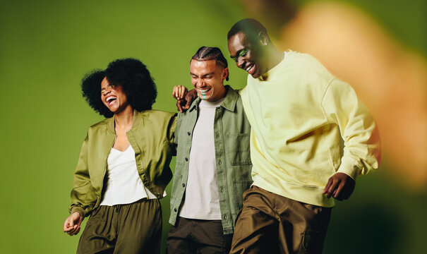 Young friends dance together in the studio with youthful rhythm and fun energy