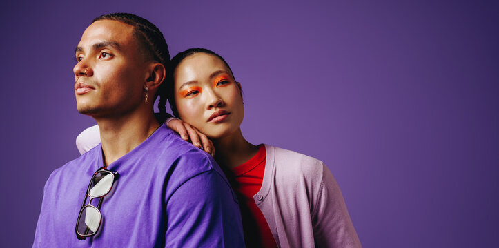 Friends lean together in a beauty-focused studio portrait with relaxed style