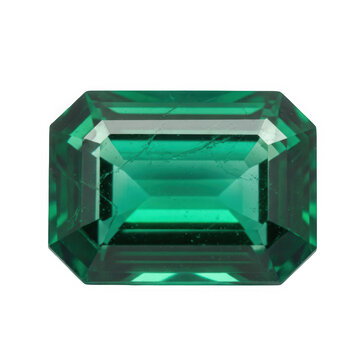 Green emerald cut gemstone on reflective surface isolated on transparent background