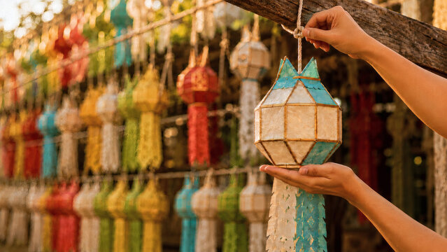 Hands Hanging Colorful Lanna Lantern for Yi Peng Festival Decoration