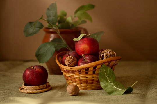 Natural background: red apples in a woven basket for making a pie