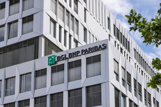 Luxembourg City, Luxembourg - 7 August 2026: Architectural low angle view of BGL BNP Paribas modern office building facade with company logo.