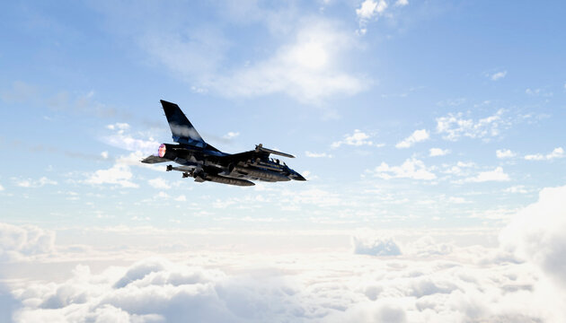 A military fighter jet flying high above clouds in a clear blue sky