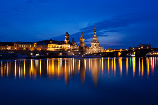 Germany, Saxony, Dresden, View of skyline of Staendehaus, Frauenkirche, Katholische Hofkirche, Semperoper, Bruehl's Terrace, Dresden Castle and Augustus bridge with Elbe waterfront at night