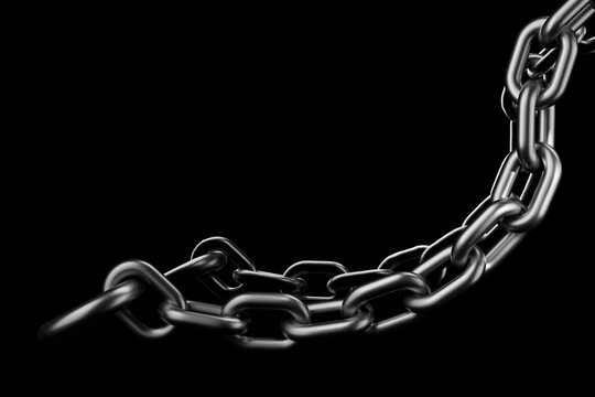 A heavy metal chain hangs against a dark black background