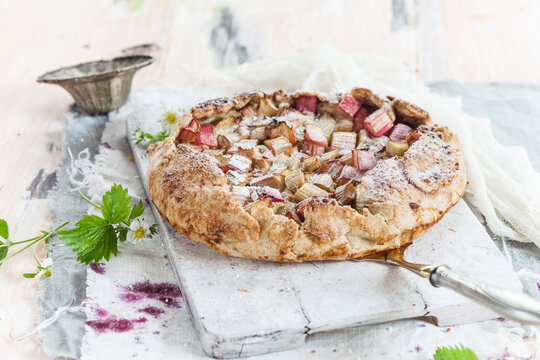 Galette, crusty french cake, with rhubarb filling
