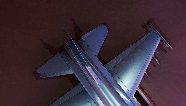 Aerial view of a modern military fighter jet in a dark hangar