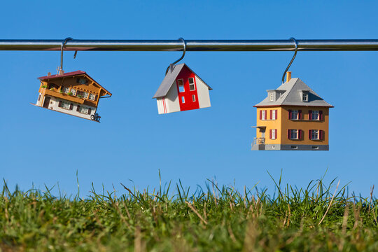 Germany, Baden Wuerttemberg, Stuttgart, House model hanging on steel rod