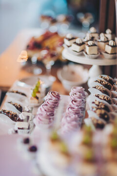 Wedding candy bar and different cap cakes. Candy bar. Table with sweets, candies, dessert. cookies and sweets with gorgeous arrangement