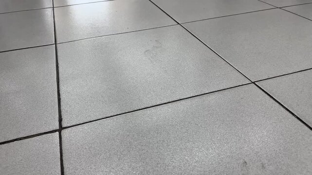 Perspective angle view of white ceramic floor tiles background