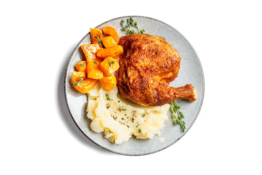 Autumn meal: chicken quarter with glazed pumpkin and mashed potato