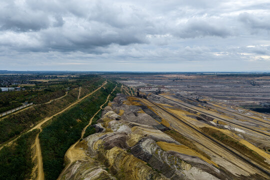 Aerial view of Tagebau Hambach open-pit mine showing large-scale excavation, terraced slopes, and industrial mining equipment in Elsdorf, Nordrhein-Westfalen, Germany.