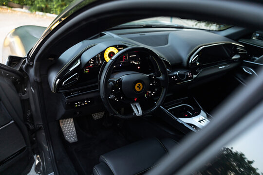 Ferrari Purosangue interior, luxurious Italian craftsmanship, premium leather cabin, sophisticated dashboard, high-end materials, sporty steering wheel, elegant modern design, exclusive automotive int