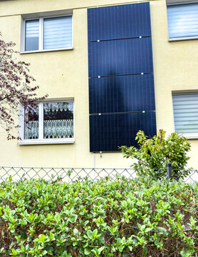 Wall-Mounted Solar Panel on a House in the City &ndash; Renewable Energy and Sustainable Urban Living