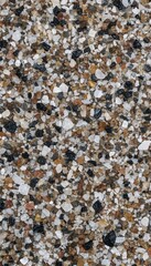 Fototapeta premium Top view macro crushed quartz sand grains with black basalt and brown mineral pebbles texture background vertical mobile wallpaper illustration