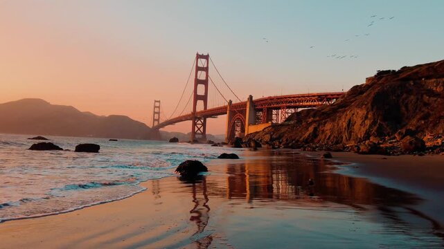 Sunset at Golden Gate Bridge from Baker Beach in San Francisco, California, overlooking the Pacific Ocean, rugged coastline and iconic bridge architecture, 4k.