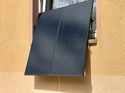 Solar panel on a house window for renewable energy in the city