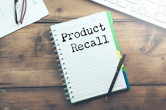 A notebook with product recall text