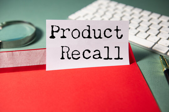 A notebook with product recall text