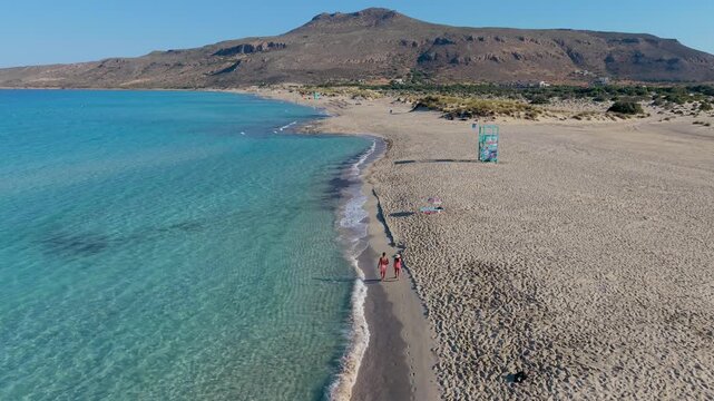 Experience the breathtaking views of Simos Beach on Elafonisos, Greece. Crystal-clear waters and golden sands create a perfect getaway for relaxation and adventure under the sun.
