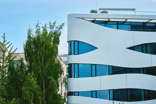 Contemporary Office Building with Curved Glass Facade