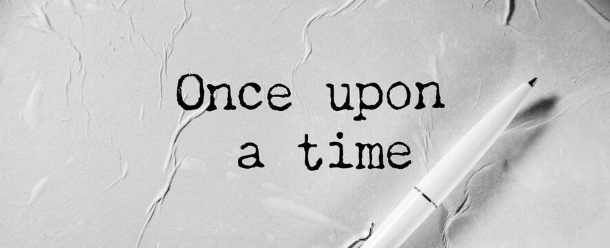 once upon a time, text on white paper