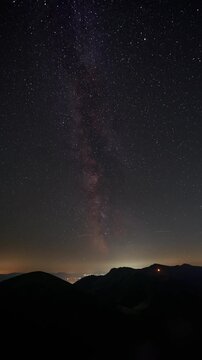 Vertical Timelapse of Milky Way Galaxy Over Mountain Ridges at Night
